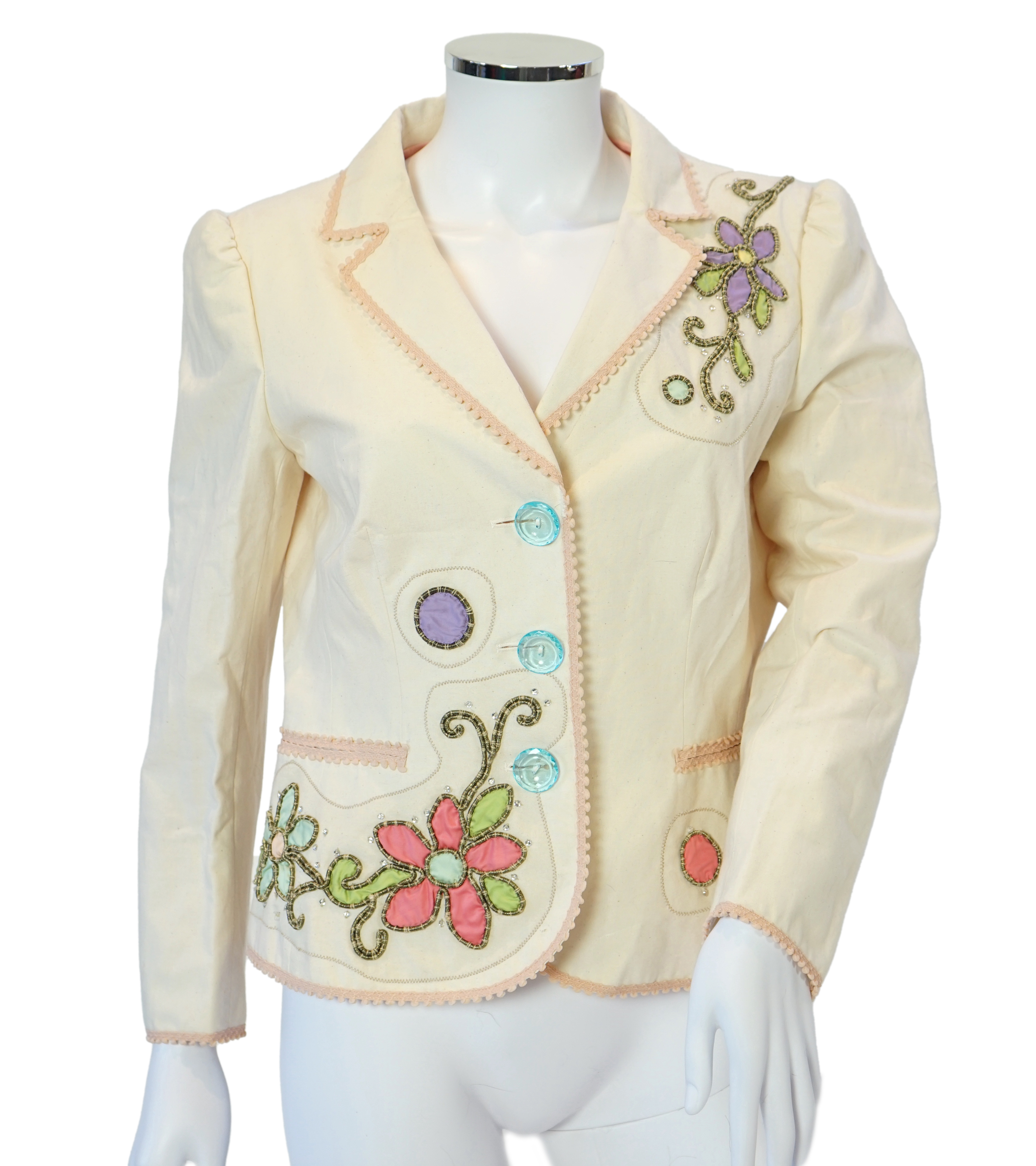 A Moschino lady's long blue and red jacket, a cream cotton embellished blazer and a cotton pair of floral trousers, blue and red jacket size 14, cream blazer size 12, trousers size: 10